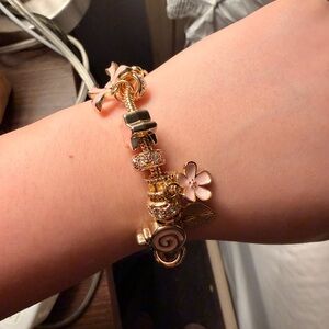 Elegant Gold and Pink Charm Bracelet